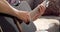 Close-up of male hands playing acoustic guitar at home