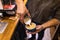 Close up of male hands pouring milk and preparing fresh cappuccino. Coffee artist and preparation concept. Morning coffee