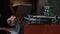 Close-up of male hands putting record in turntable, retro turntable playing in home library, selective focus