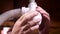 Close up of male hands repairing a leaking siphon in the kitchen or bathroom
