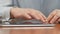 Close up of male hands scrolling on tablet, viewing photos in social media