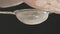 Close-up of male hands sifting flour through small metal sieve.