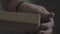 Close-up male hands touch a polished wood product. woodworker ironing his product. 4k video. 59.94 fps