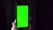 Close-up of male hands touching of smartphone. Green screen Chroma Key. Close up. Tracking motion