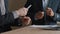 Close-up male hands two unrecognizable multiracial business men in formal suits african and caucasian colleagues stand