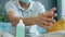 Close-up of male hands using sanitizer at home washing palms carefully