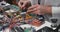 Close up of male hands working with soldering iron