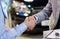 Close up of male handshake in auto show or salon