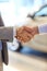 Close up of male handshake in auto show or salon