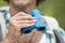 Close-up of male hiker holding binoculars