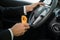 Close-up of a male holding snack while driving