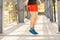 Close up of male legs skipping with jump rope outdoors. Exercising and lifestyle concept