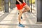 Close up of male legs skipping with jump rope outdoors. Exercising and lifestyle concept