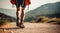 Close up male legs walking on nature mountain path