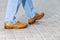 Close-up of Male Legs Wearing Leather Brown Oxford Semi Brogues Shoes. Photographed in Motion