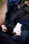 Close Up Of Male Passenger Sitting In Train With Digital Ticket On Mobile Phone