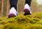 Close Up Of Male Runners Feet On Run Through Landscape