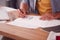 Close Up Of Male Student Or Business Owner Working In Fashion Sketching Designs In Studio