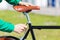 Close up of man adjusting fixed gear bike saddle