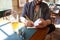 Close up of man with beer and notebook at pub