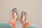 Close up of man in Black slippers feet standing at the beach,