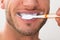 Close-up of man brushing his teeth