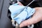 Close-Up Of Man Checking Car Engine Oil Level On Dipstick