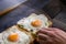 Close-up of man chef cook two fresh crispy sandwich