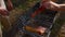 Close-up of man cooking juicy pieces of meat on grill. Stock footage. Man cooks two delicious pieces of red meat on