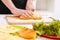 Close up of man cutting bread