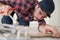 Close-up man cutting ceramic tiles with handy machine