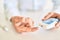 Close up of man with diabetes using insuline glucometer with blood from the finger