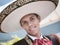 Close Up Of A Man Dressed In Traditional Mexican Outfit And Wearing Sombrero