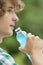 Close-up of man drinking energy drink outdoors