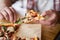 Close up of man eating a slice of authentic brick oven fired pizza