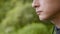 A close up of a man that eats fast food outdoors