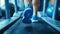 Close-up of man feet on a treadmill running at the gym or at home