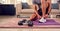 Close Up Of Man In Fitness Clothing At Home Fastening Trainers Before Exercising With Hand Weights
