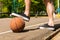Close Up of Man with Foot on Basketball on Court