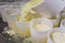 Close-up of a man forming cheese into the plastic molds at the small producing farm.