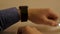 Close up of man with glass of water and pill looking at wristwatch or smart watch. business man look smartwatch for