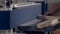 Close-up of man grinds wood products on industrial machine. Action. Carpenter polishes wooden product for tape