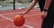 Close up man handling a ball, throwing and scoring on basketball court. Healthy lifestyle and sport concept.