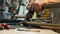 Close-up of man hands adjusting a mountain bike in his workshop.