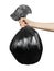 Close up man hands holding black garbage bag. Isolated on white