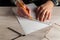 Close-up of man hands holding a pencil and a ruler. Working environment on the office table before creating a plan for or