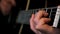 Close up of man hands masterly playing chords. Concept. Musician plaing acoustic guitar, composing music in rock genre.