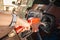 Close up of man hold an old petrol pump filling up fuel at gas station