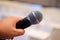 Close up of a man holding microphone