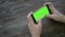 Close Up Man Holding Smartphone Touch Screen With Green Screen Chroma Key For